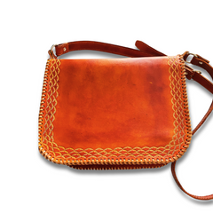 Brown Cuyuni leather bag displayed on a flat surface made by Gy Crafts