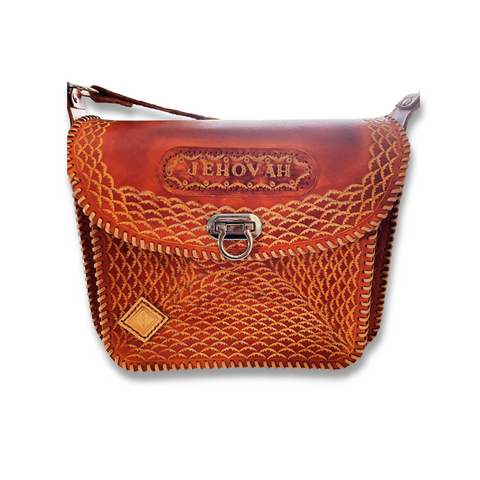 Brown Cuyuni leather bag displayed on a flat surface made by Gy Crafts.