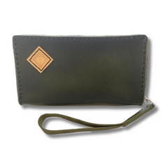 Black Puruni wristlet, featuring zip closure, single strap and hand stamped. Made by Gy Crafts.