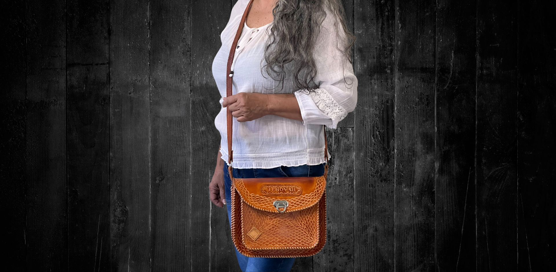 Model displaying a brown Cuyuni bag hanging from a single long strap on her shoulder. Made by Gy Crafts