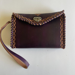 Purple Ituni wristlet made with 4 oz Argentinian leather with zip closure, a single strap with buckle and a beautiful flap. Made by Gy Crafts.